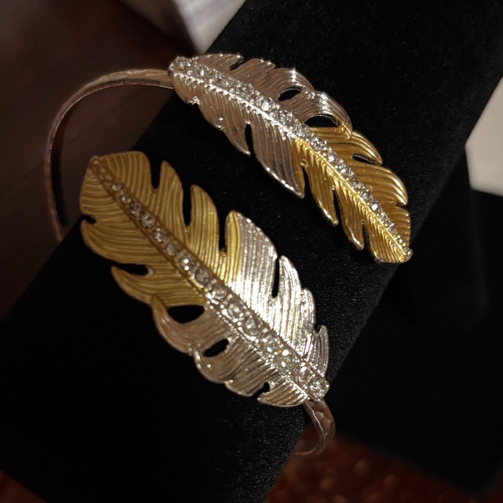 Gold and silver toned cuff feather bracelet